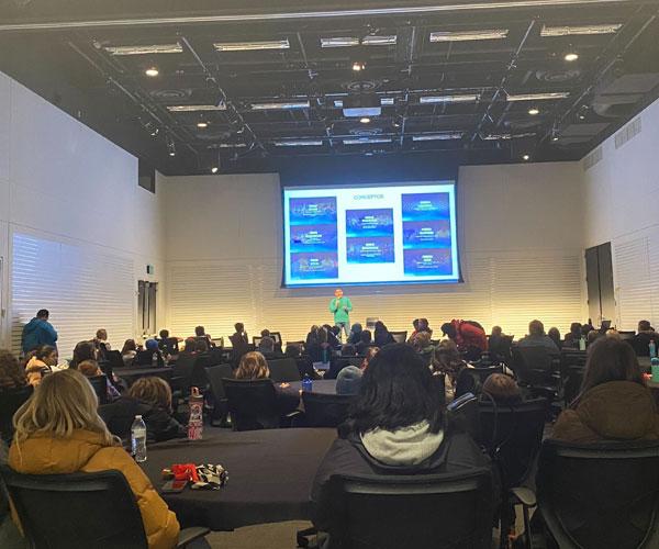 Students and teachers from Arco Iris Spanish Immersion School participate in a presentation in a conference room at Nike World Headquarters.